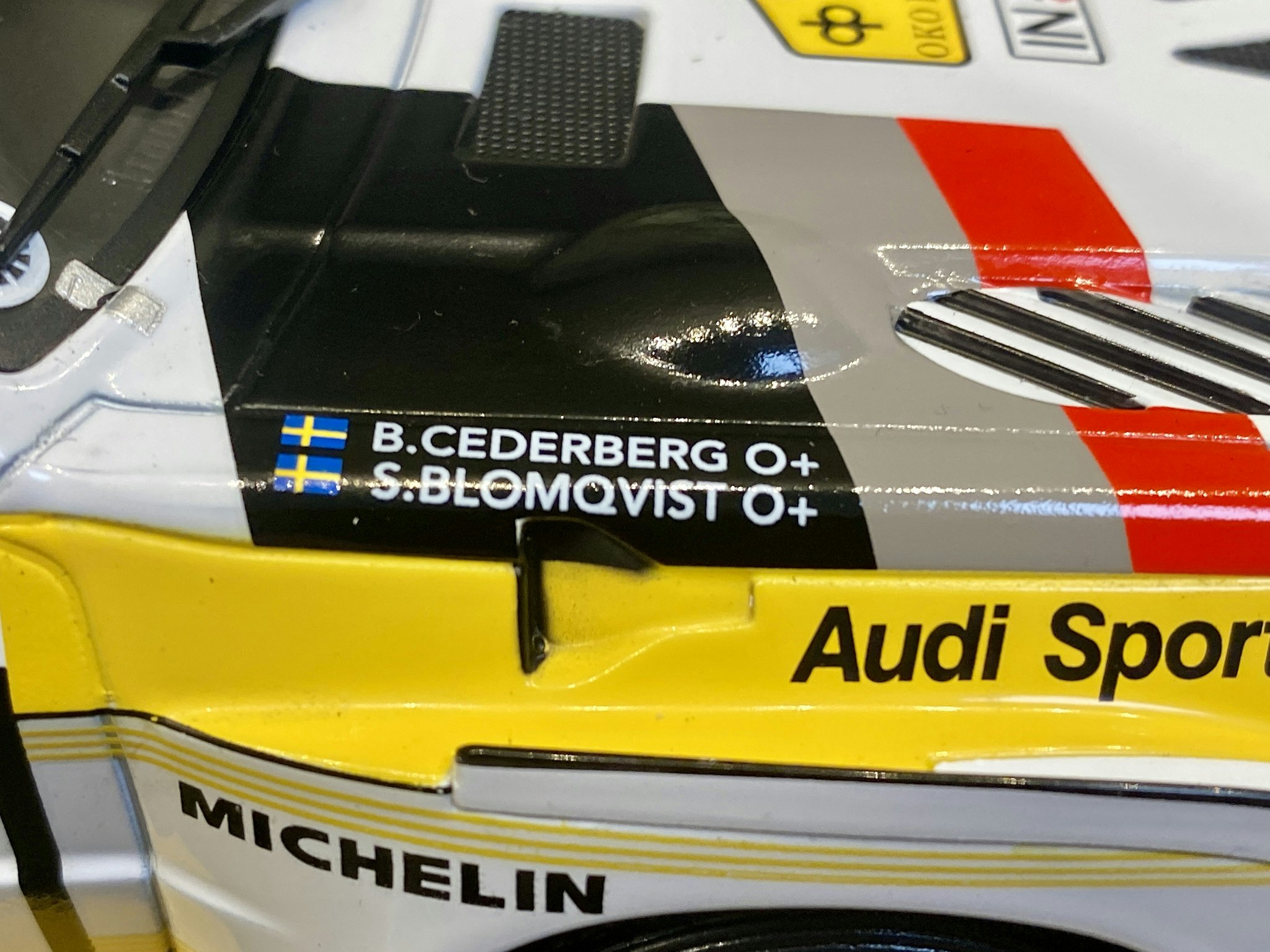 Skala 1/18 Audi Sport Quattro S1 E2 #4 S.Blomqvist/B.Cederberg fr IXO Models