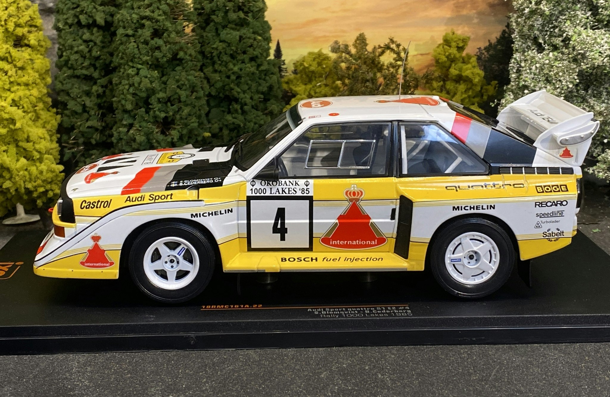 Skala 1/18 Audi Sport Quattro S1 E2 #4 S.Blomqvist/B.Cederberg fr IXO Models