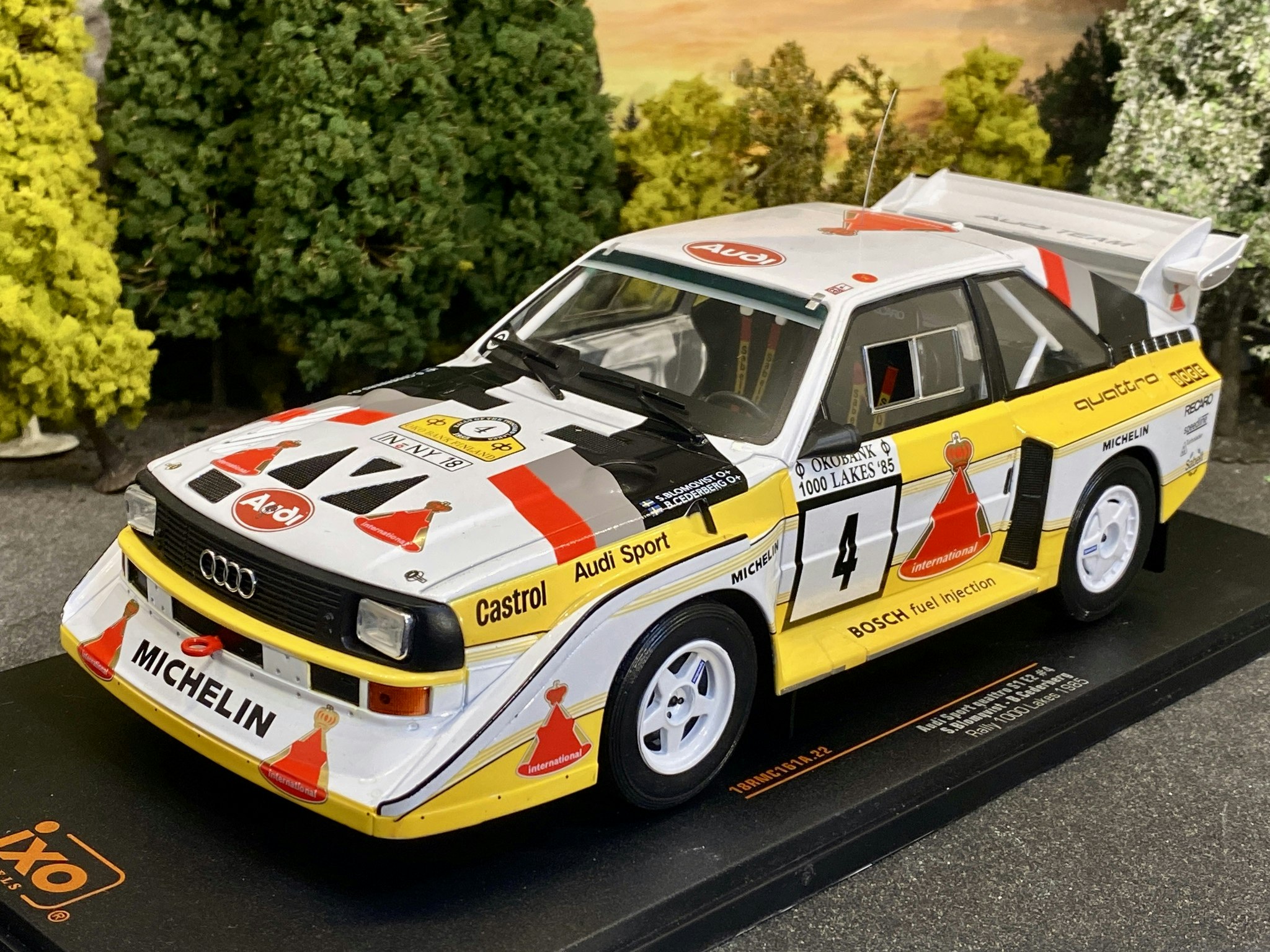 Skala 1/18 Audi Sport Quattro S1 E2 #4 S.Blomqvist/B.Cederberg fr IXO Models