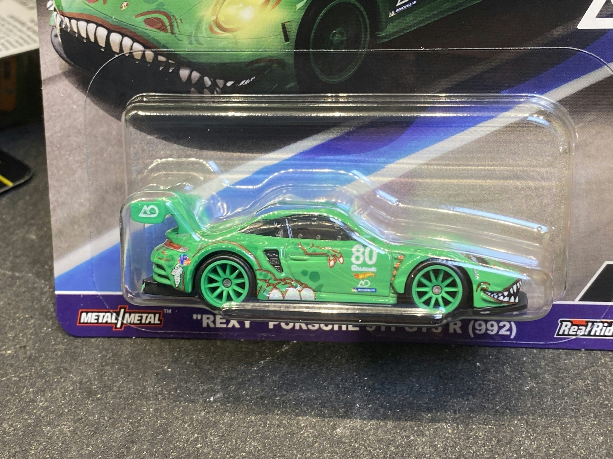 Skala 1/64 Hot Wheels Premium, Car Culture Race Day: "Rexy" Porsche 911 GT3 (992)
