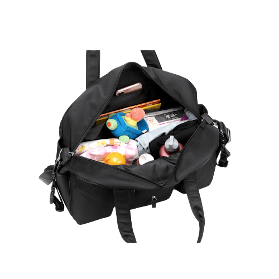 Svart skötväska som är öppen