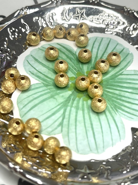 Mellandelar stardust av mässing guld 4 mm (50st)