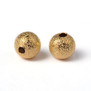 Mellandelar stardust av mässing guld 4 mm (50st)