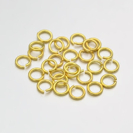 Små bindringar, 4mm, mässing, guld (100st)