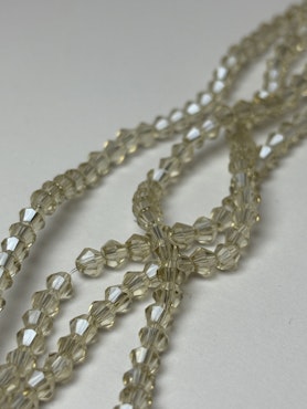 Sträng biconeslipade glaspärlor, Champange 4mm (ca 85st)