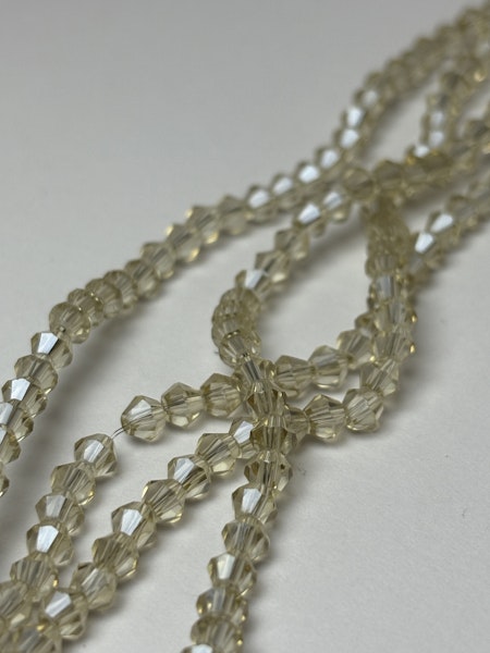 Sträng biconeslipade glaspärlor, Champange 4mm (ca 85st)