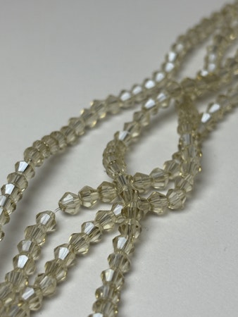 Sträng biconeslipade glaspärlor, Champange 4mm (ca 85st)