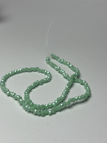 Sträng slipade rondeller, glaspärlor, Ismint 2mm (ca 145st)