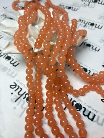 Sträng med glaspärlor, Jadeimitation, dovt orange, 8,5mm (100st)