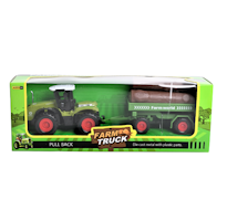 Grön traktor med timmersläp