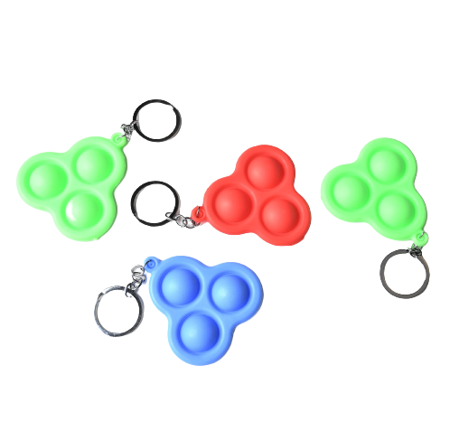 Nyckelring i form av en fidget leksak,  pop it finger leksak. För rastlösa fingrar.
