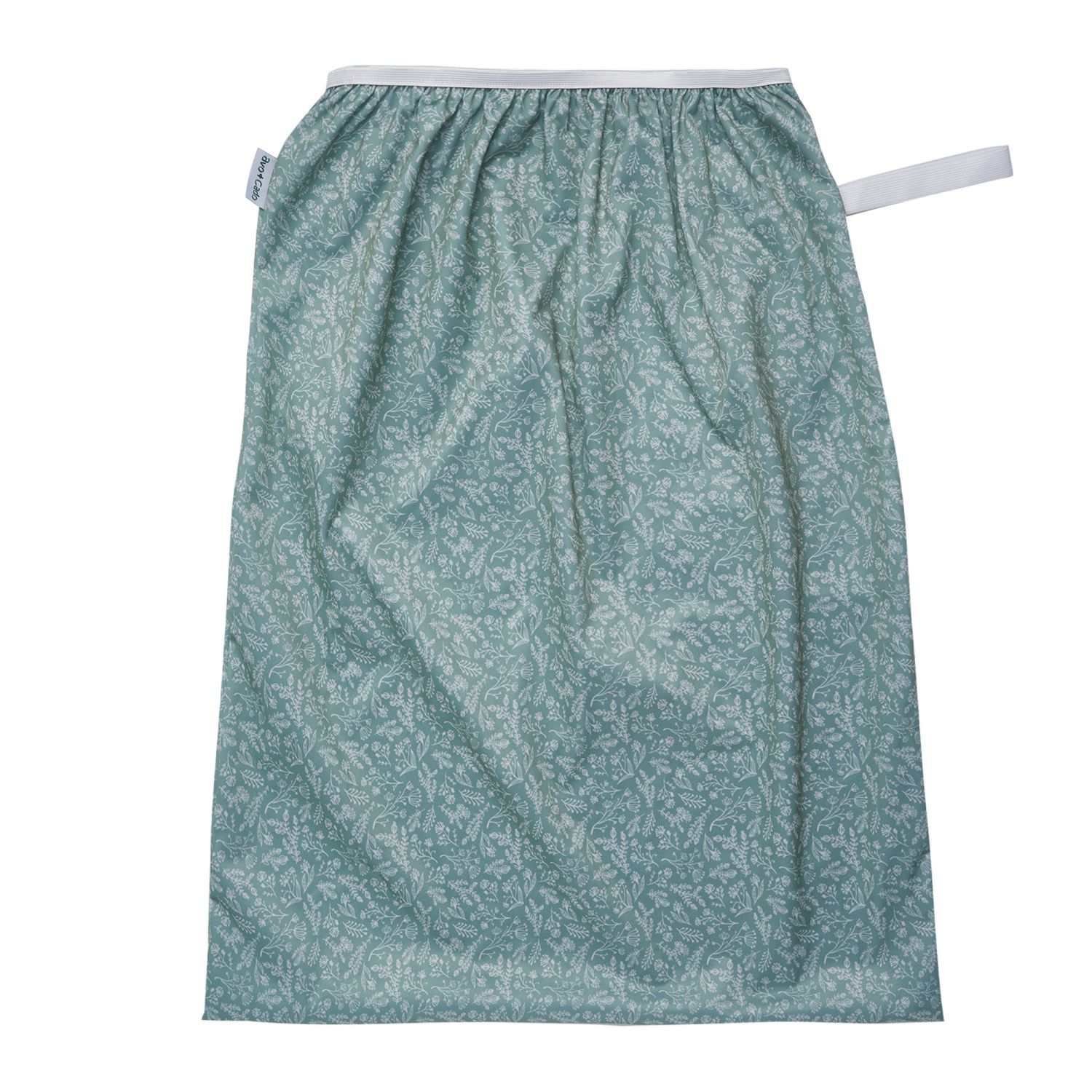 en Pail liner, dvs en stor pul-påse att sätta i en tvättkorg för förvaring av tygblöjor, i grönt med mönster utav vita blad och blommor. Från Avo&Cado. A pail liner for storing dirty cloth diapers in 
