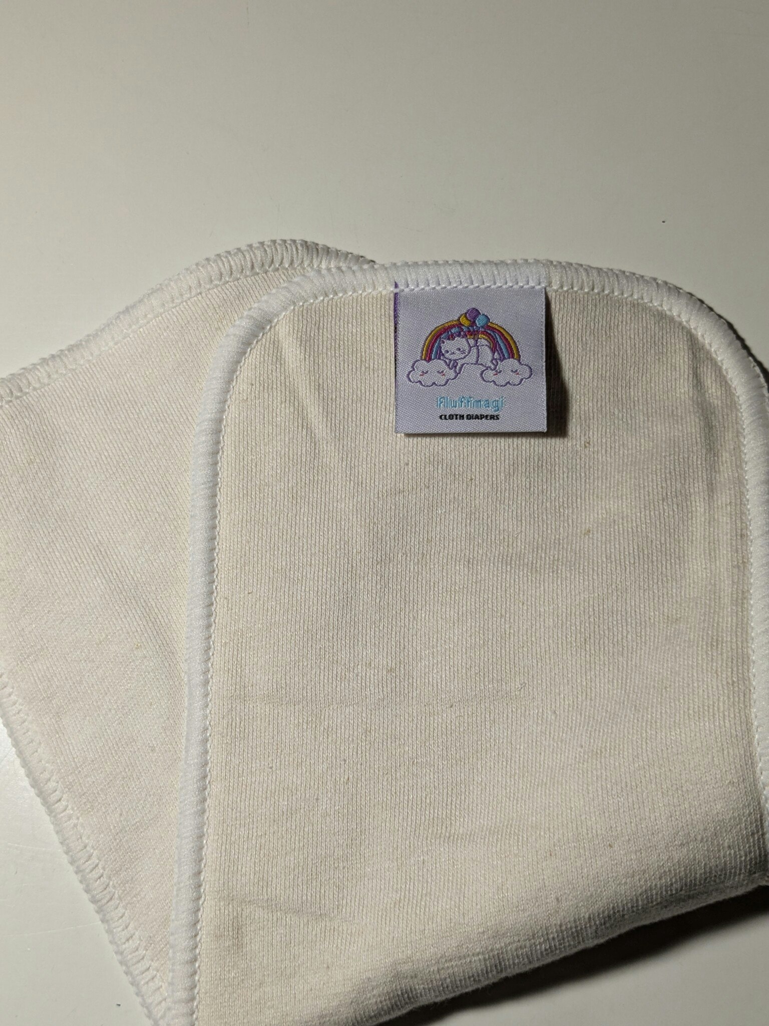 Fluffmagis, stort hampa inlägg, trasig söm
