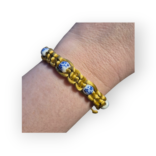 Armband guld med blommig pärla