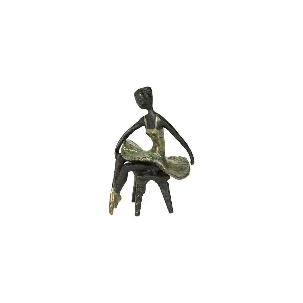 Ballerina sidder