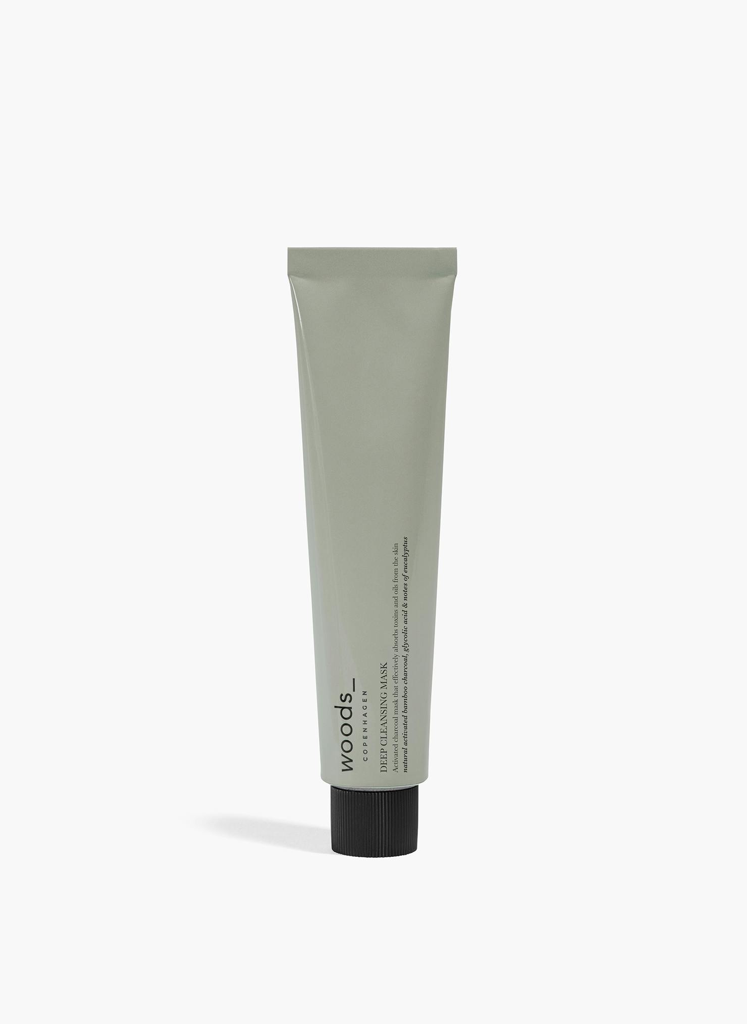 Stylish grey tube with an active charcoal mask for deep cleansing pot the skin, for men and women. Organic and natural.