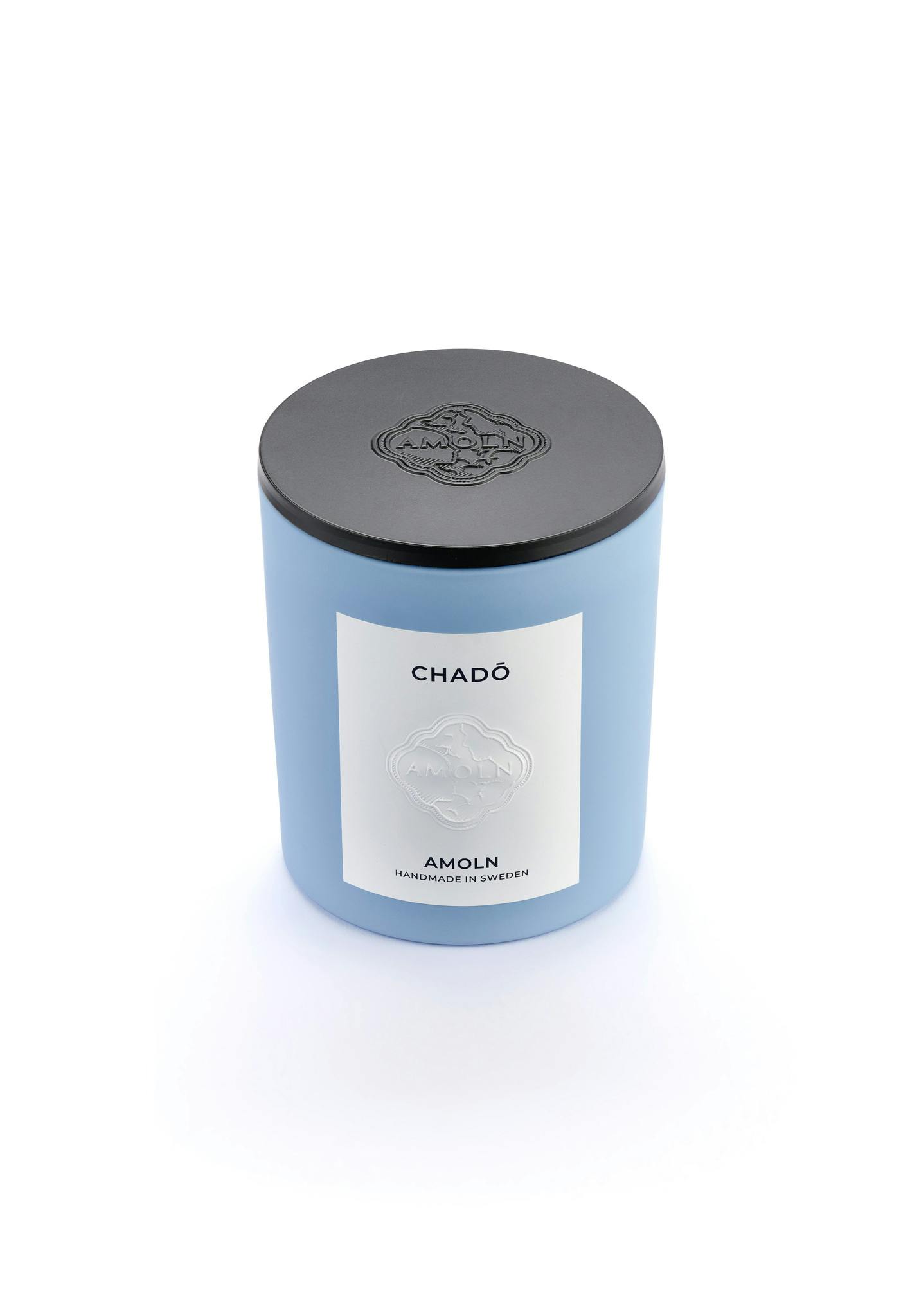 Light blue ceramic candle jar with a vegan, scented candle in blue wax for a luxurious gift. Handcrafted by artisans in Sweden. Sustainably & ethically made.