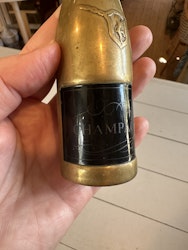 Öppnare i form av champagneflaska