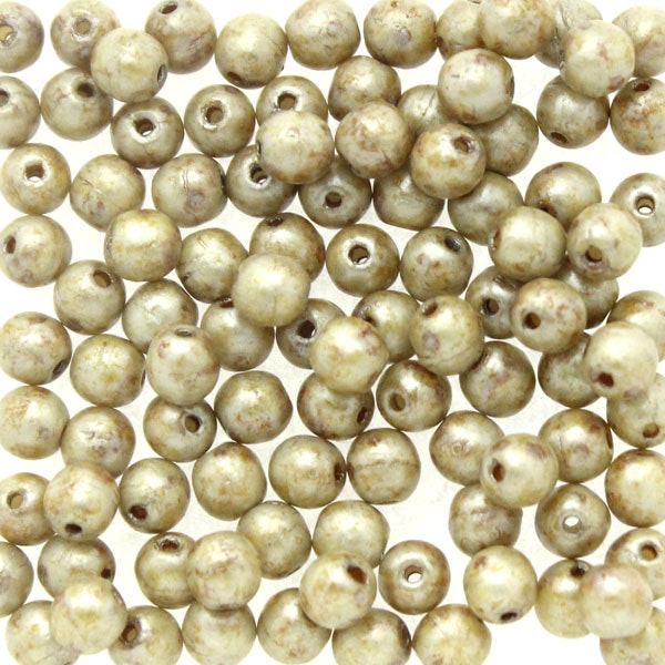 Opaque Ivory Spotted Runda/Druks 3mm 100st