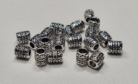 20 silverfärgade spacer beads i metall (5x6 mm)