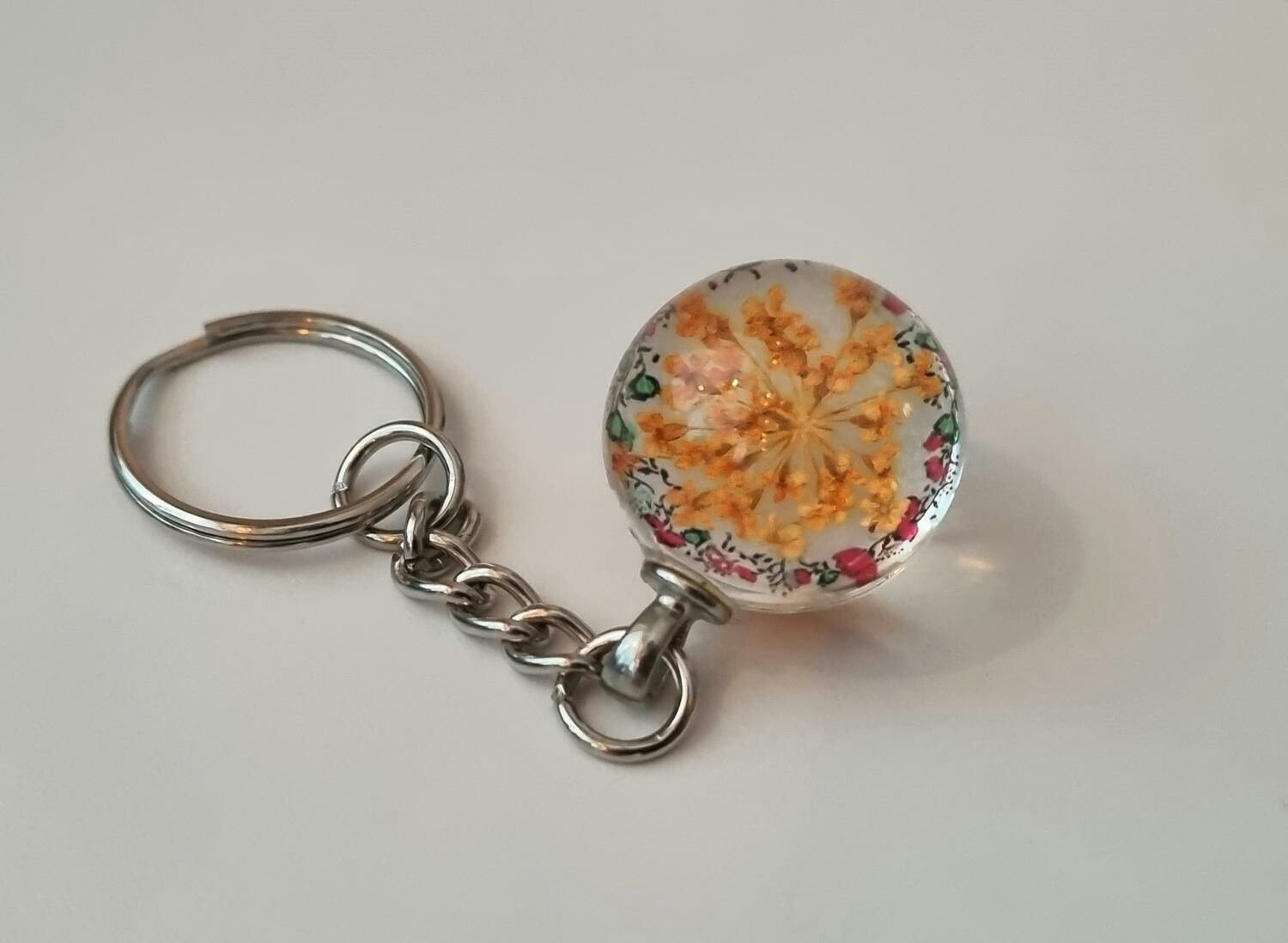 Nyckelring Glaskula glasboll med torkad blomma (Orange)