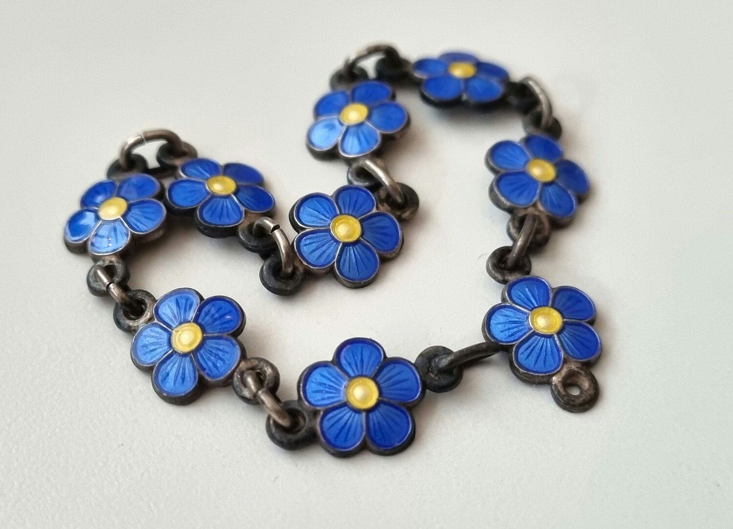 Armband, små blå/gula blommor