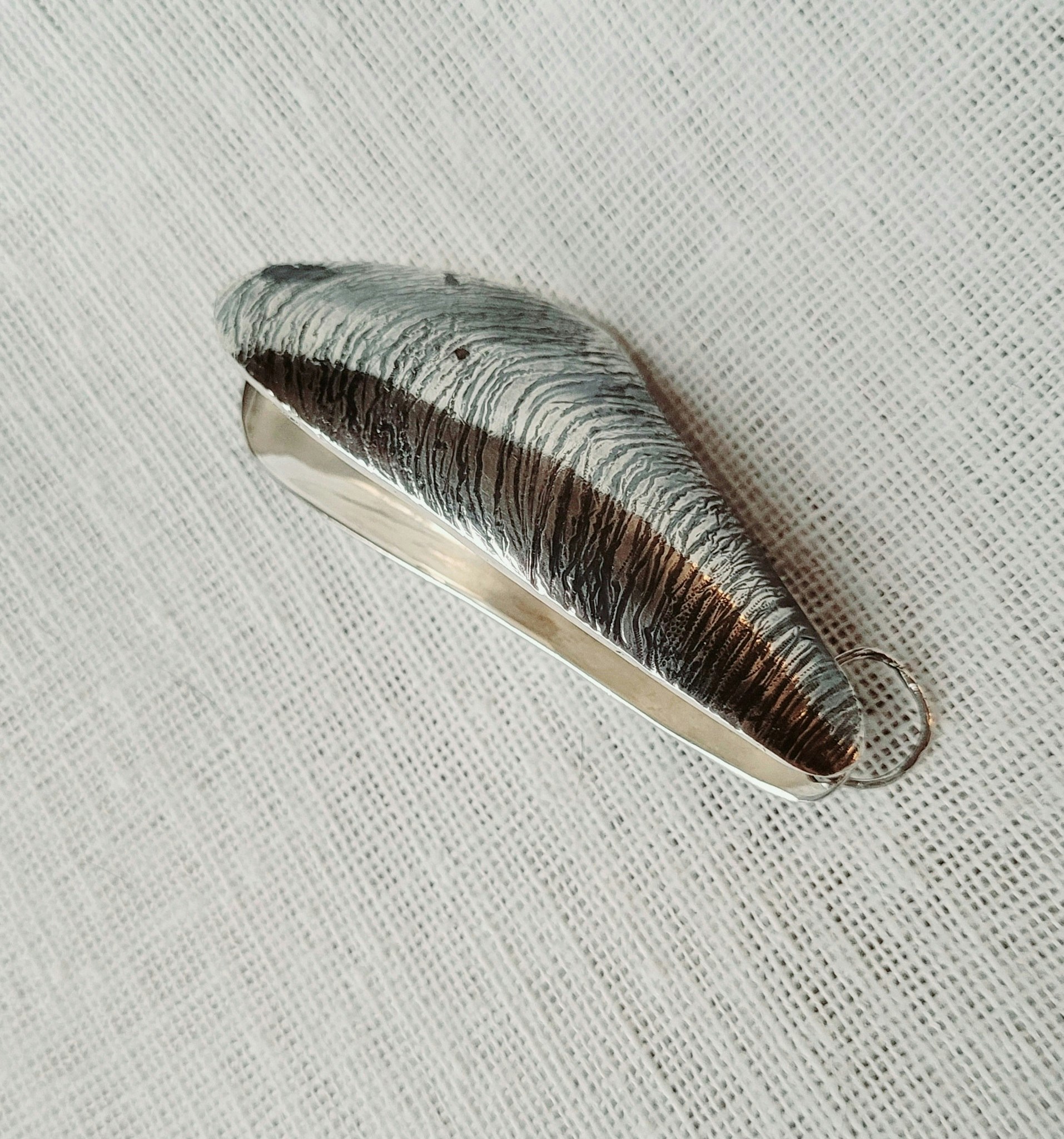 Silvermussla med pärla