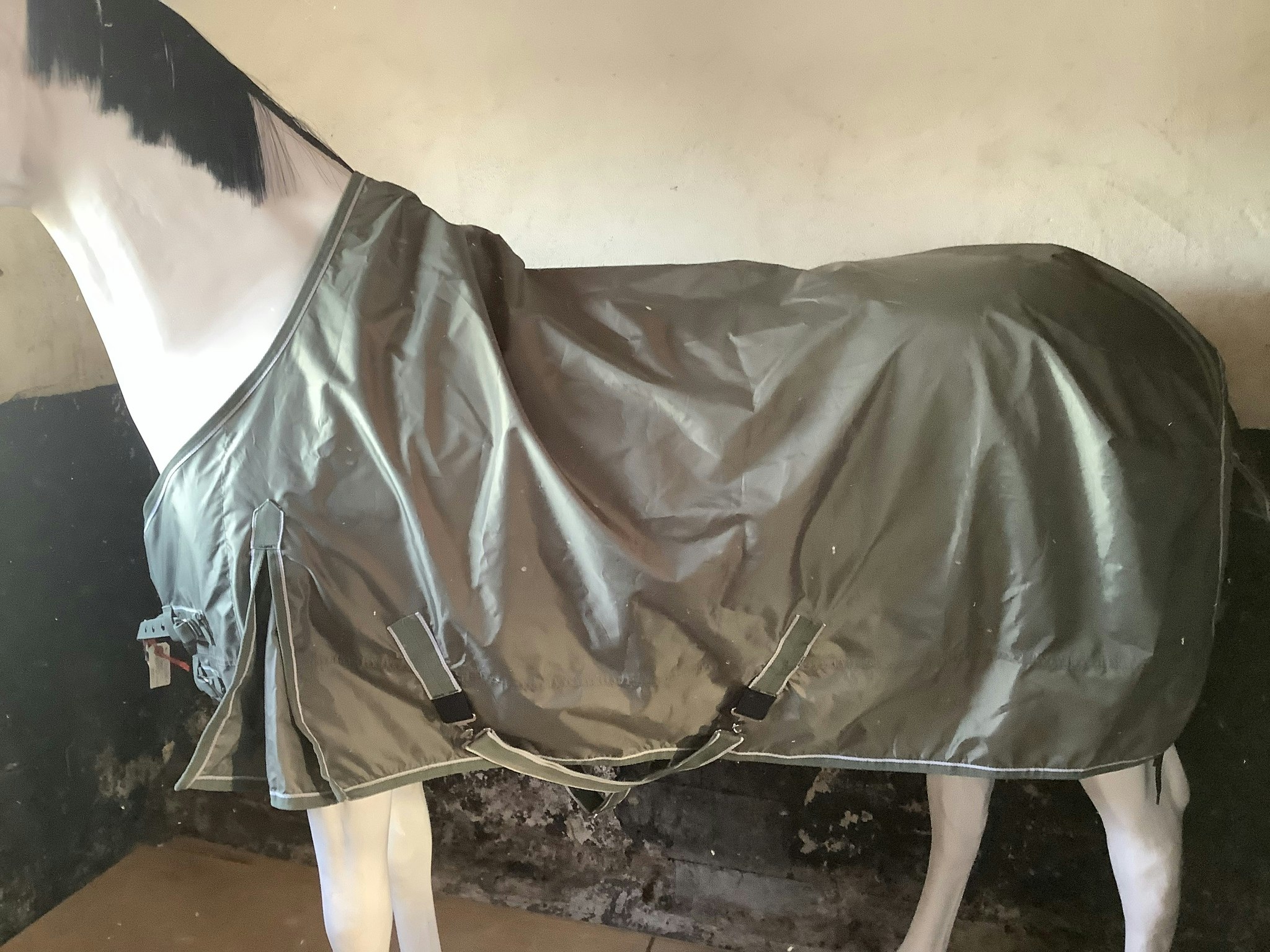 Regntäcke,grönt,125 cm,ett snabbknäppe fram sönder men går ändå att knäppa