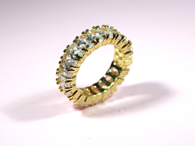 GOLD OVAL STONE ETERNITY RING