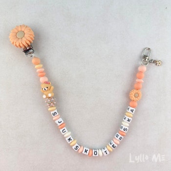 ID-KORT/ NYCKEL HÅLLARE med text Sjuksköterska med bling - DAISY CLIPS APRIKOS