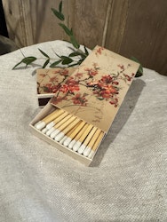 Tändstickor med rosenkvitten