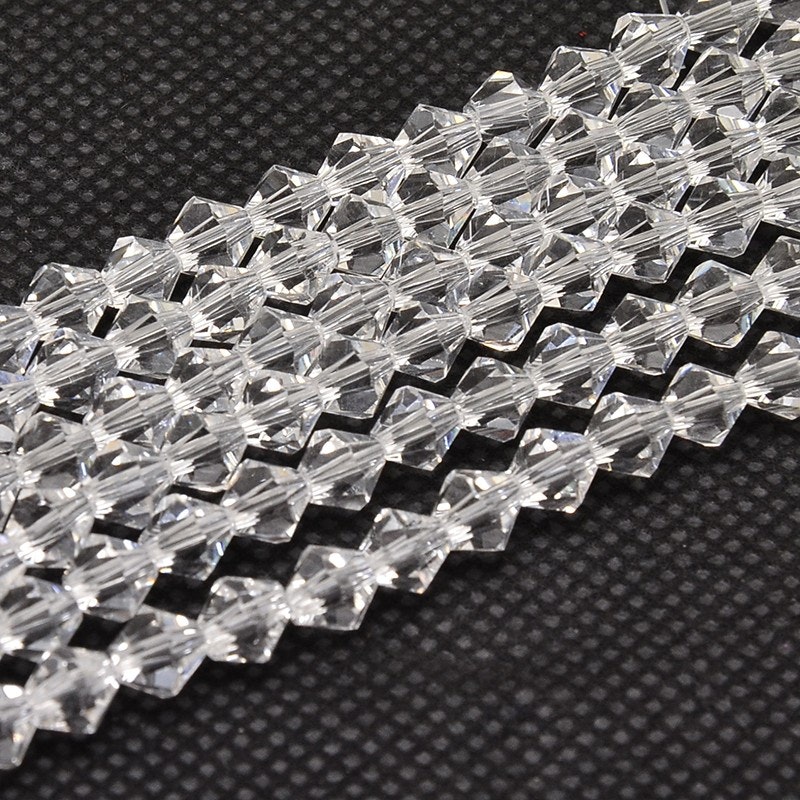 2557 Glaspärlor bicones 2x3mm transparent sträng