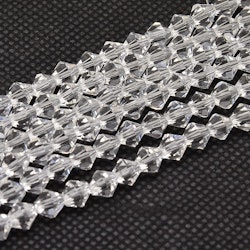 2557 Glaspärlor bicones 2x3mm transparent sträng
