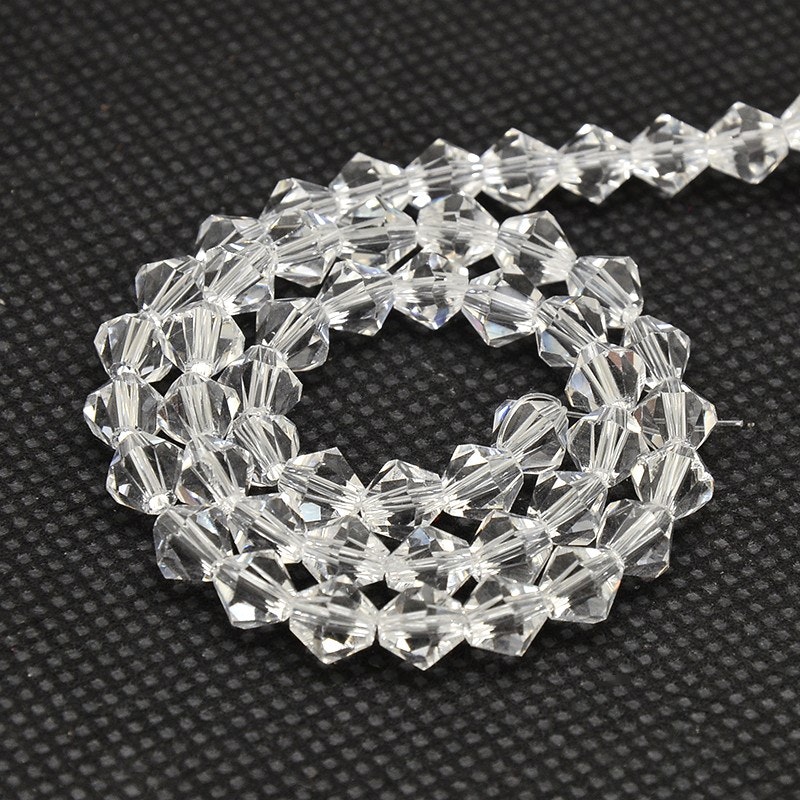 2557 Glaspärlor bicones 2x3mm transparent sträng