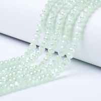 3060 Glaspärlor imitead jade fasetterad rondell 6mm på sträng pale green