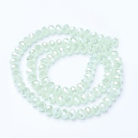 3060 Glaspärlor imitead jade fasetterad rondell 6mm på sträng pale green