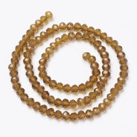 3070 glaspärla fasetterad rondell 4x3mm golden rod