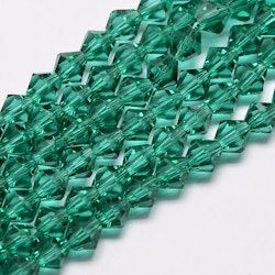 3091 Glaspärlor bicones 6mm på sträng transparent dark cyan