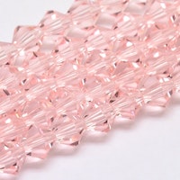 3092 Glaspärlor bicones 6mm på sträng transparent pink