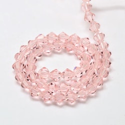 3092 Glaspärlor bicones 6mm på sträng transparent pink