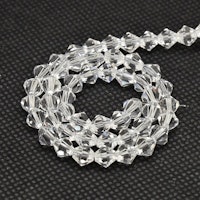 3097 Glaspärlor bicones 6mm på sträng transparent