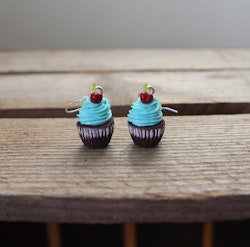 Earrings, chocolate cupcakes with turquoise frosting and cherries.