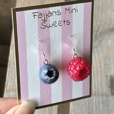 Earrings, a raspberry and a blueberry