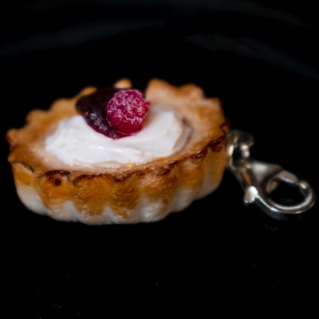 Necklace pendant, almond shell with cream and raspberries