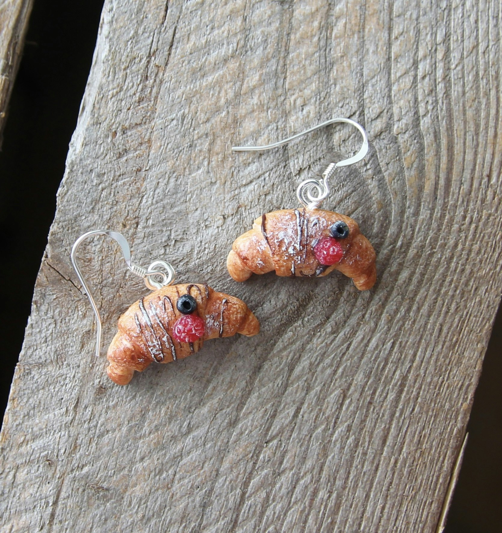 Earrings, chocolate croissants with berries