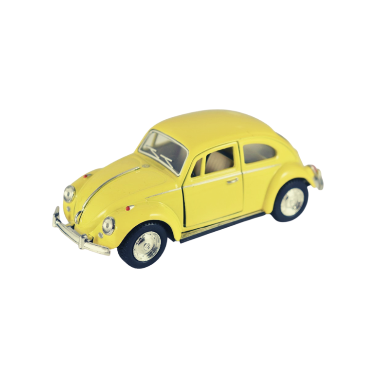 Toy car between Volkswagen classic beetle yellow 