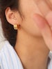 Hoops i stål med 18K guld med räfflad design