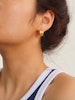 Hoops i stål med 18K guld med räfflad design