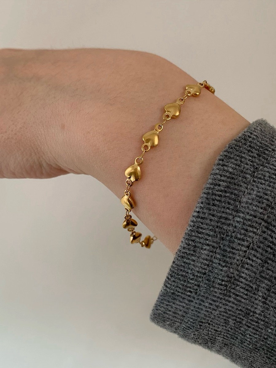 Armband i stål med 18k guld med litet hjärta