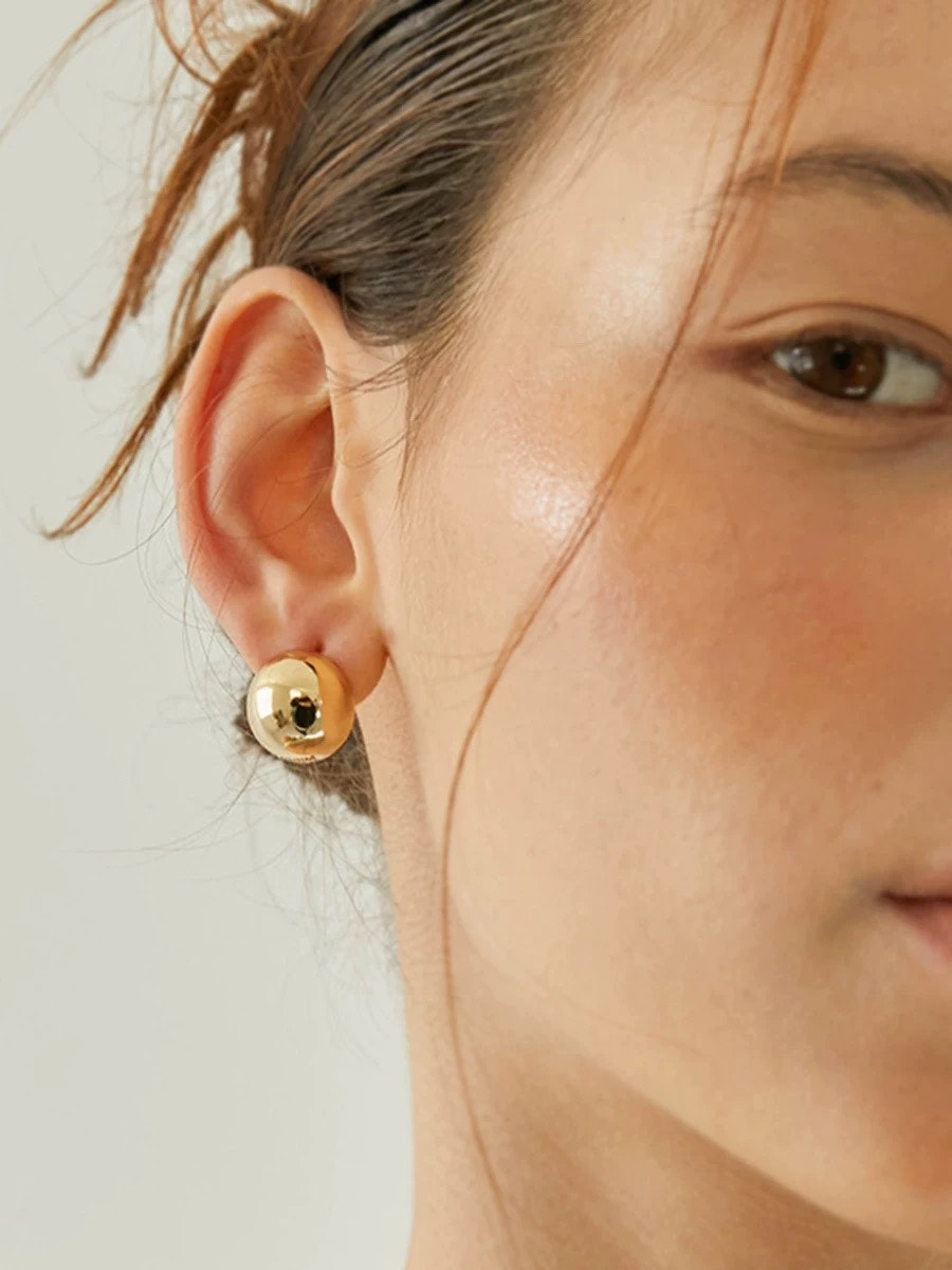 Runda klotformade  hoops i ståi med 18K guld